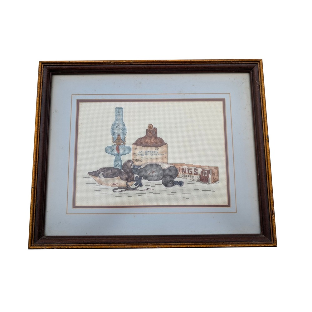 Vintage Framed Cross Stitch Duck Decoy Whiskey Jug Oil Lamp Needlepoint Art
